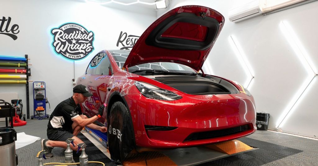 Radikal Wraps installing paint protection film on Tesla vehicle